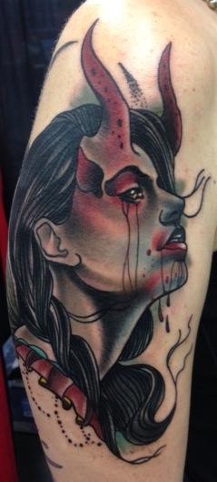 Gary Dunn - traditional girl with devil horns tattoo, Gary Dunn Art Junkies Tattoo